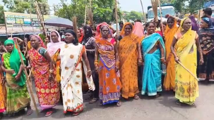 Women protested against illegal mining by blocking the road.